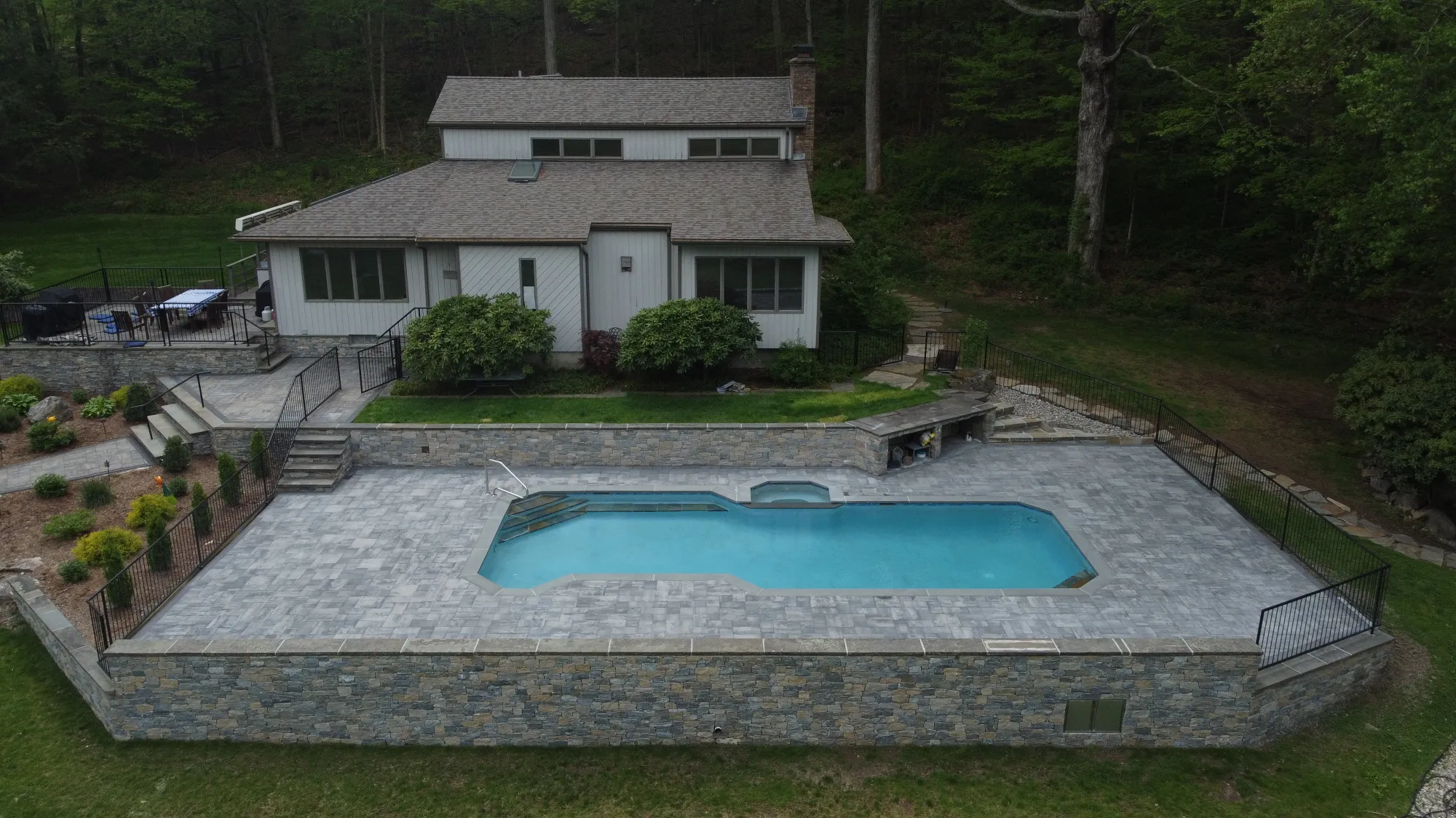 Aerial of a professional paver pool deck install in Southbury CT - Paver Pool Deck, Southbury project by General Masonry LLC.