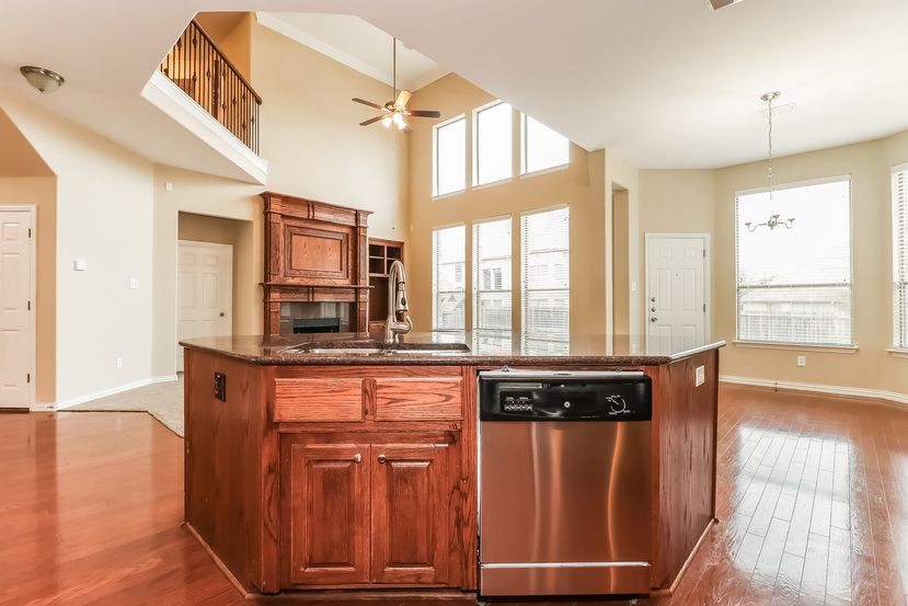 Spacious family room connected to the kitchen at Invitation Homes Houston.