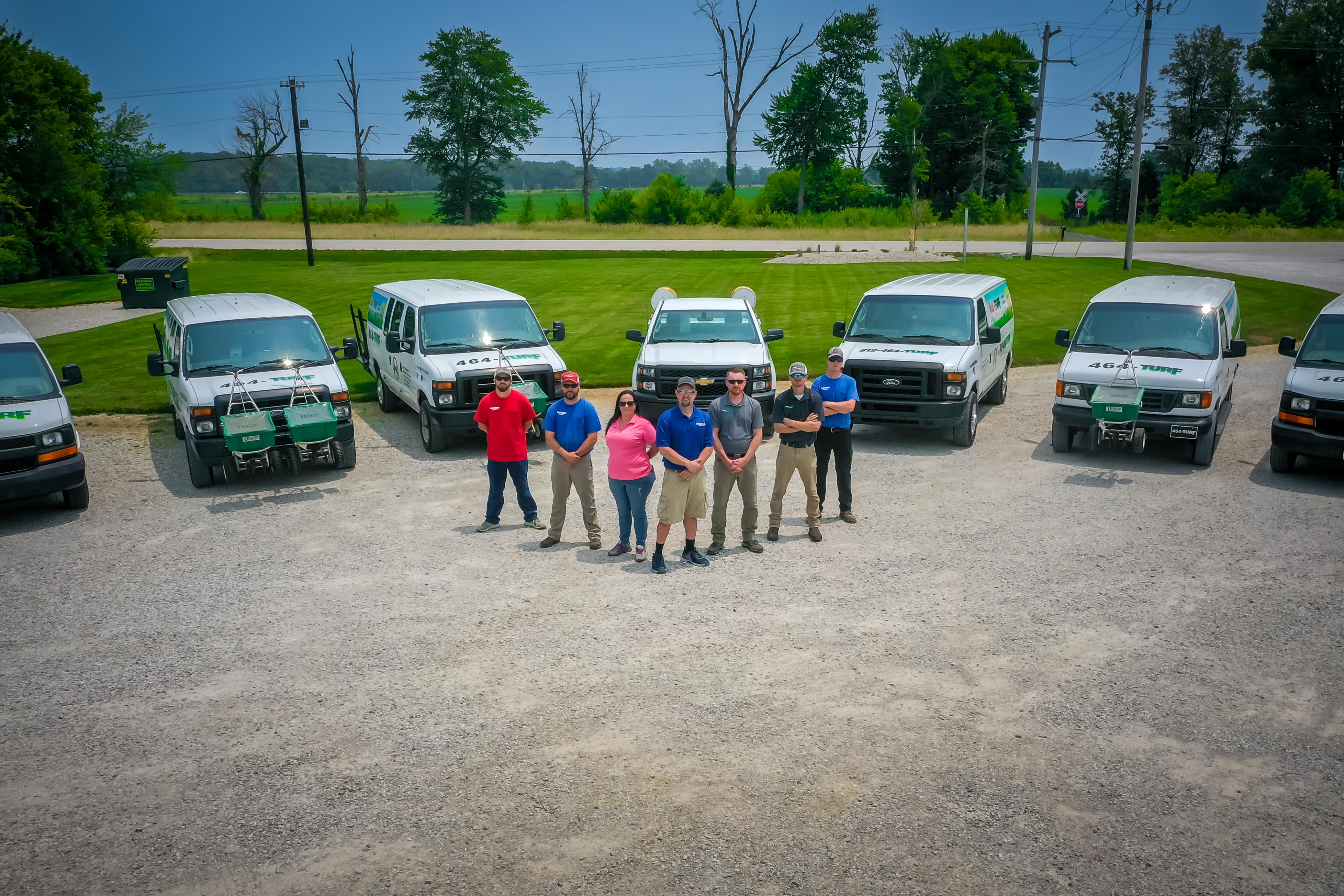 Matt’s Turf and more — Evansville, IN — the team gathers with company vehicles, showcasing the people and equipment supporting local landscaping and lawn care services.