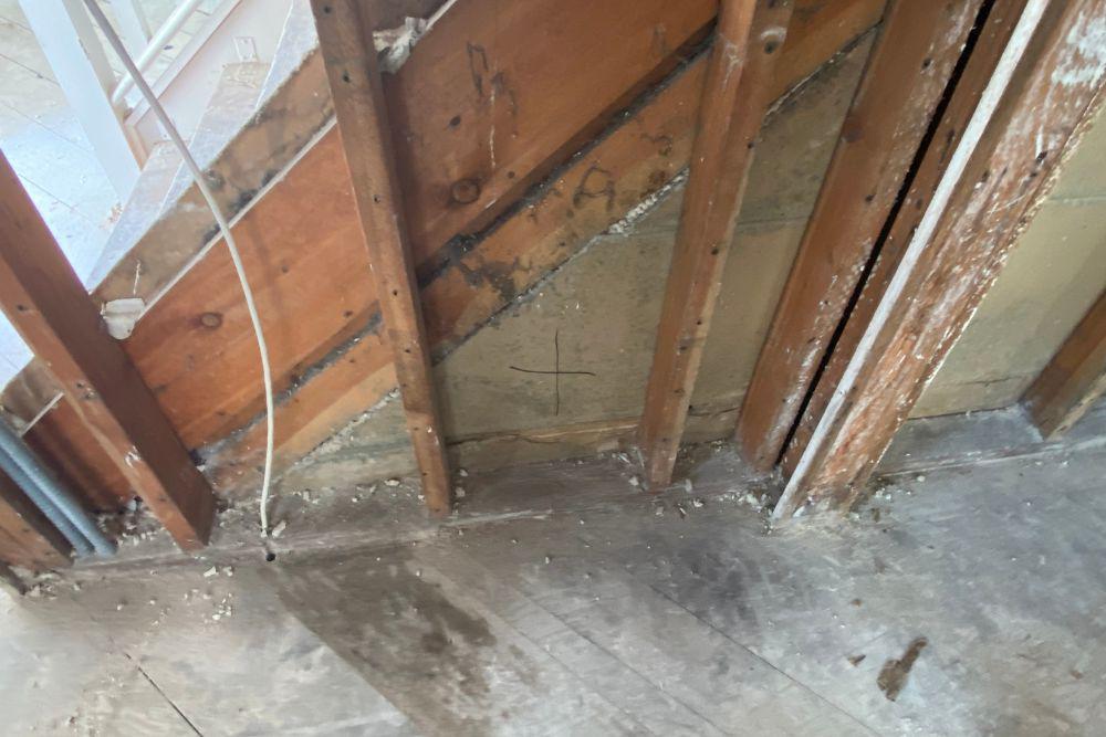 Pictured here is Danbury water damage.  This home had a slow water faucet leak in the upstairs bathroom that dripped down the stair landing to the basement for some time and caused mold to grow.
