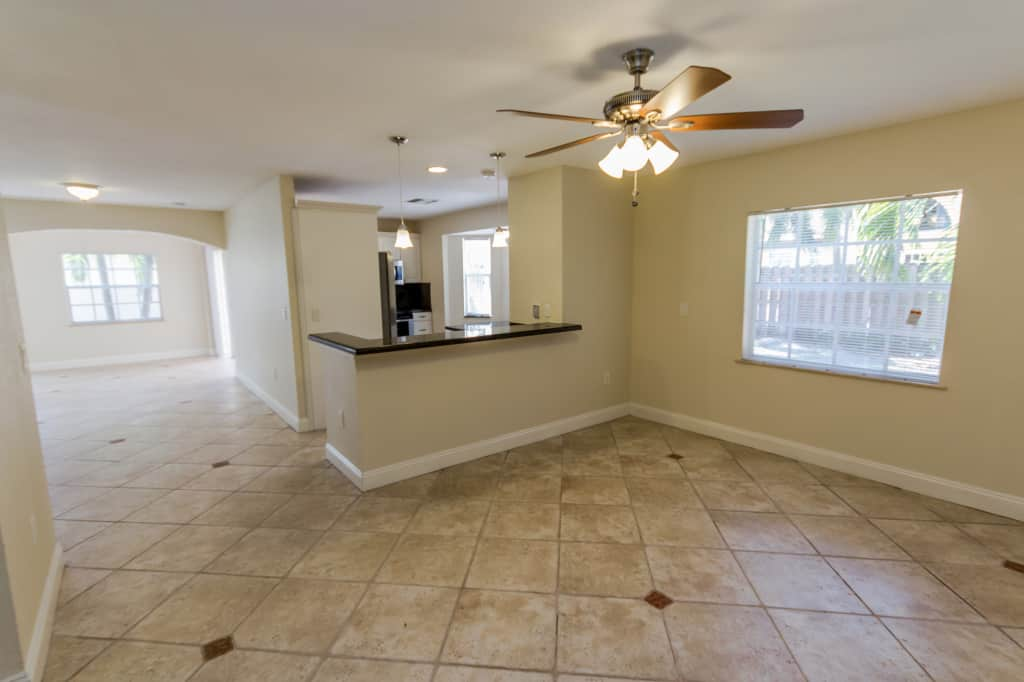 Dining nook with tile floor at Invitation Homes South Florida.