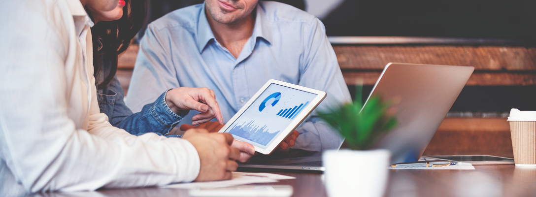 An advisor reviewing charts with their clients.