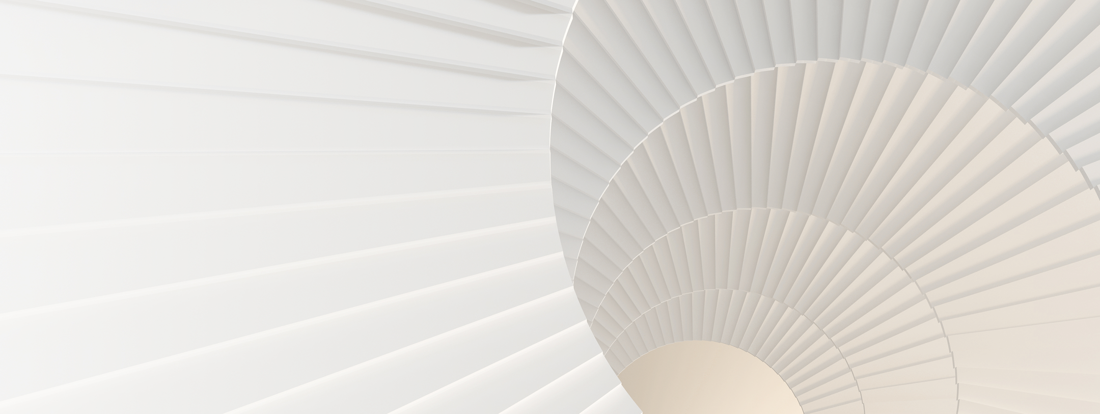 The view looking down on a white spiral staircase.