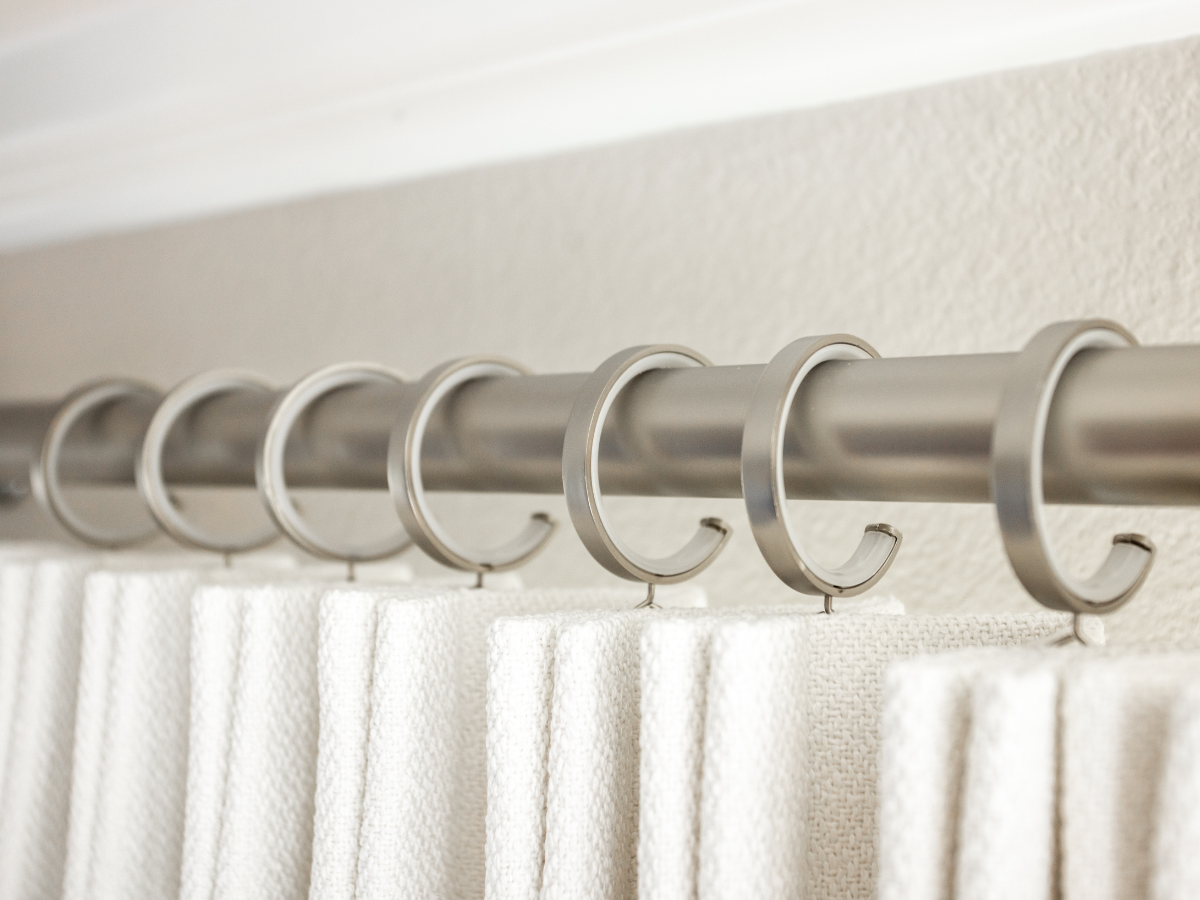 White drapery and nickel drapery hardware