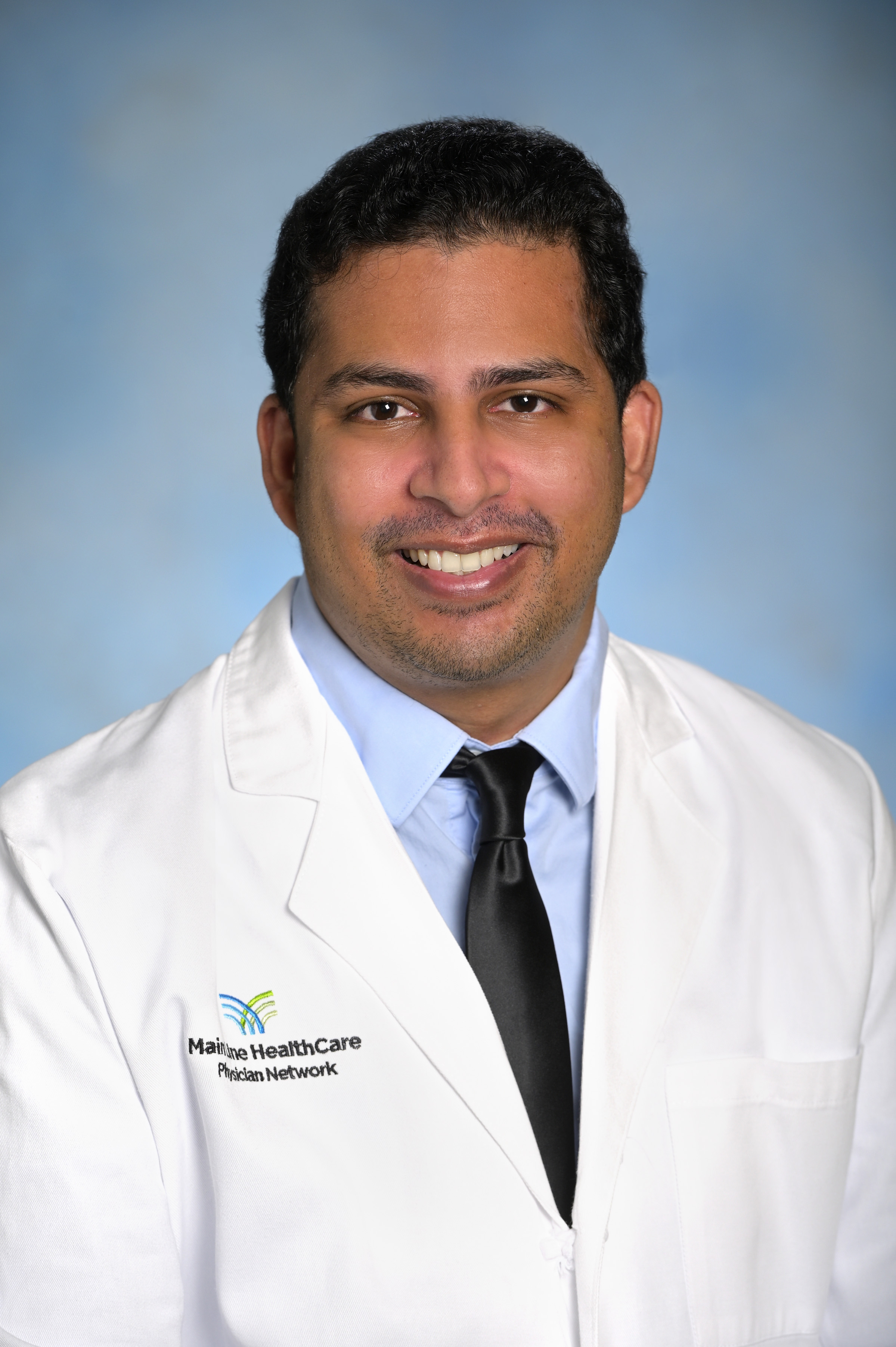 Headshot of Arun Minupuri, MD