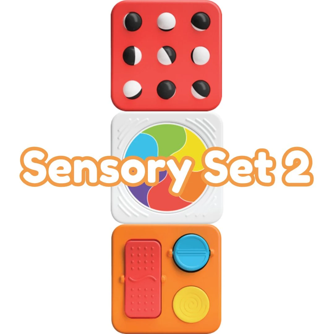 PLAYmatters features Fat Brain Toys PlayTab Activity Square Set 2 with a trackball, spinning color wheel and textured switches, offering magnetic sensory play for ages 12 months and up.