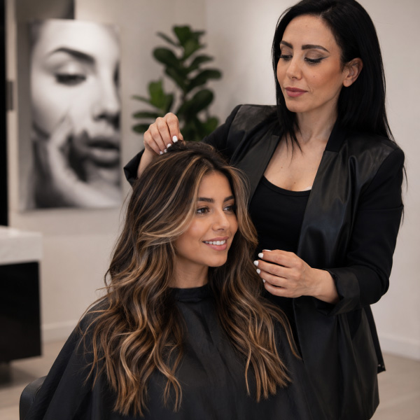 Master Stylist Kimia completes a custom highlights and haircut service at Avissa Salon in Ann Arbor. 