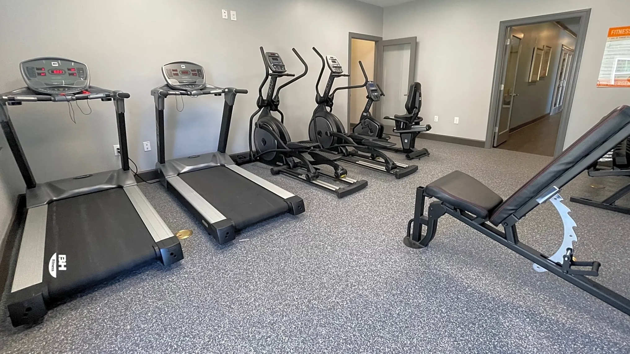Fitness center with cardio and free weights.