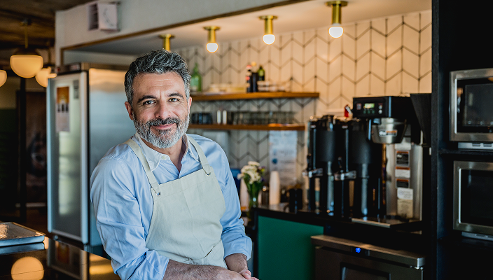 A business owner in his restaurant.
