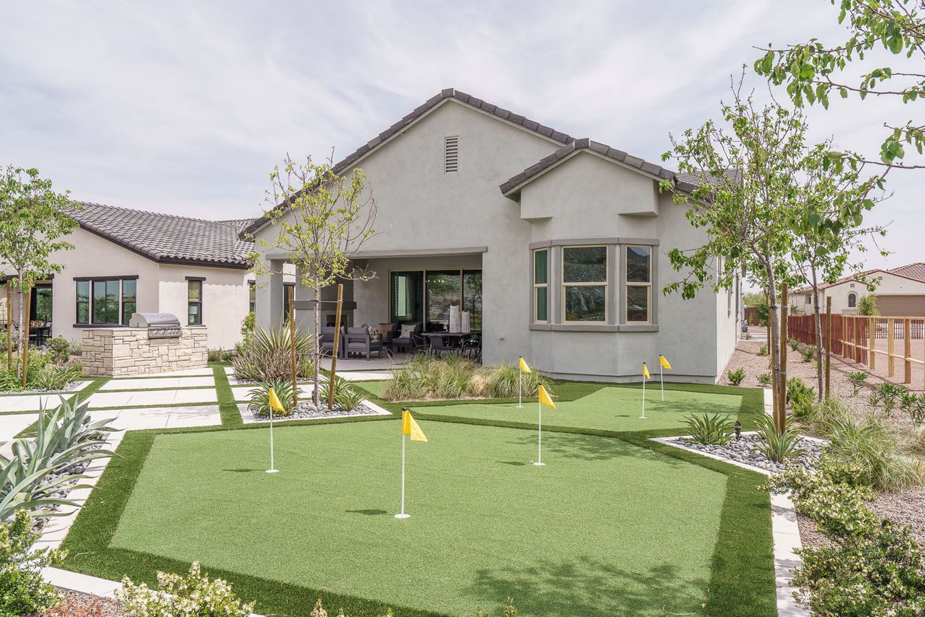 Fairways in Victory at Verrado - Sawgrass Model Home - Back of Home with Putting Green