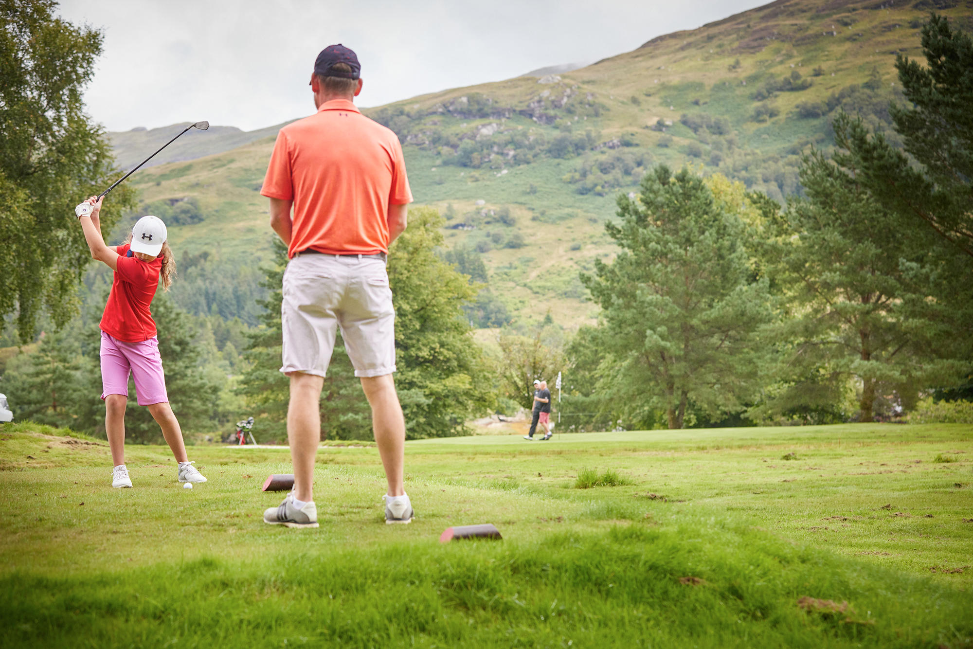 Father and daughter play a round of Golf on our 9-hole course at Drimsynie Estate