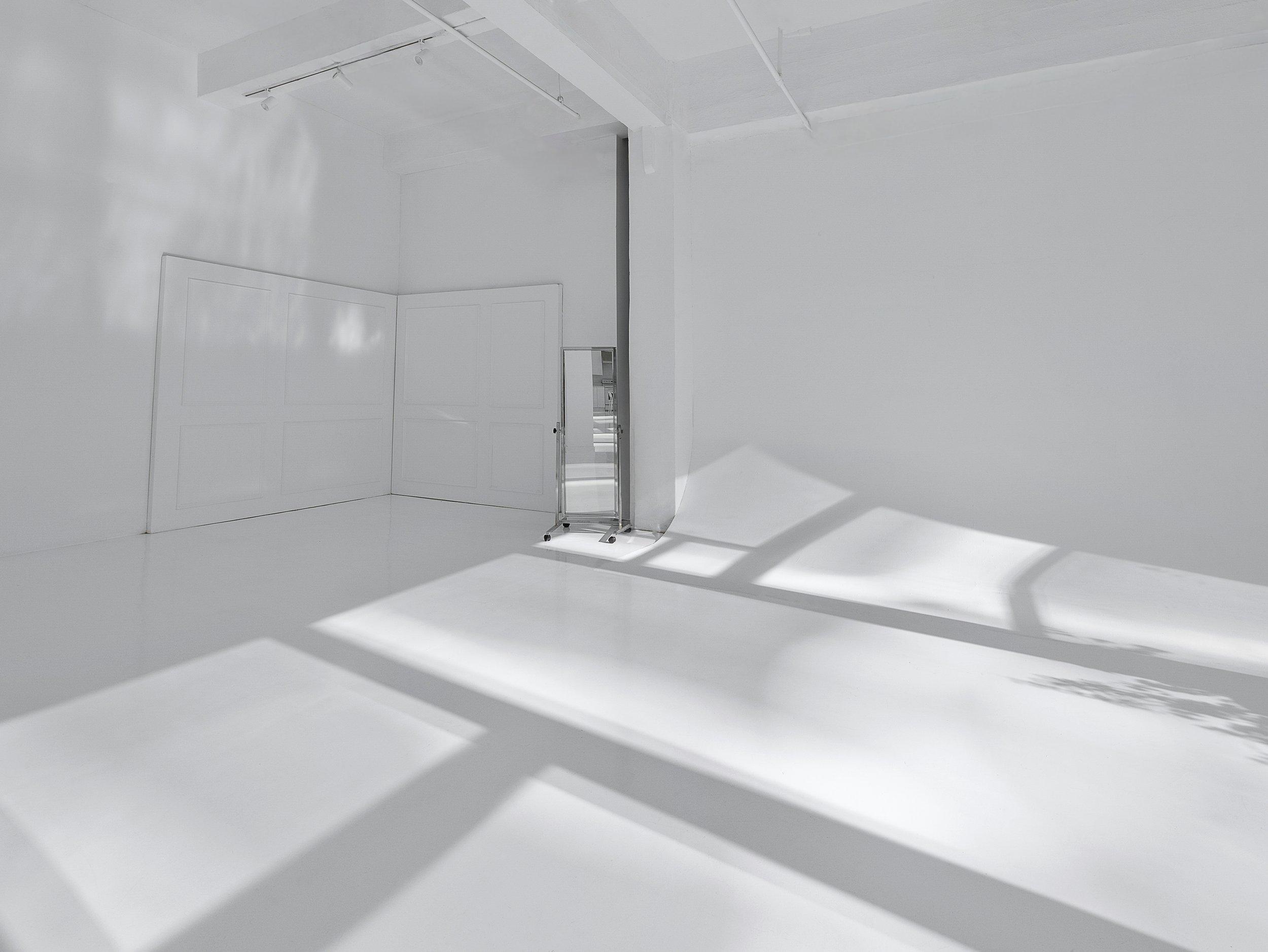 2,300 SF Studio 9, Venue Hudson Yards NYC, 14' factory windows, natural daylight, glossy white floors, 15' ceiling, dimmable track lighting, multi-set build space, photo and video studio rental New York.