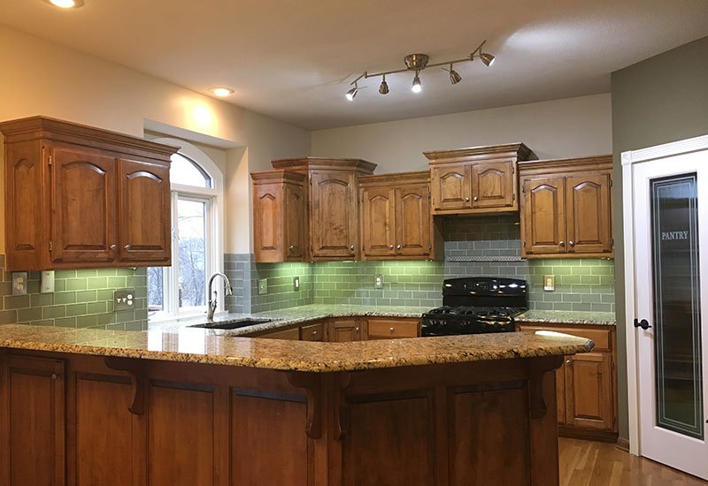 Before image of kitchen cabinet painting example by Elite Painting KC.