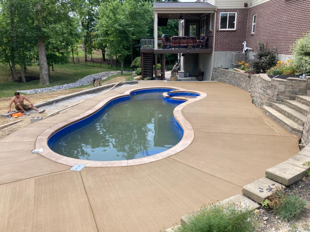 The owners of this Maineville, Ohio home wanted a pool deck that was understated but with some color. We came up with this beige stain and a light peach border around the pool. It really makes the liner pop. Do you have a backyard project you want done this year? Call and we'll get you on the schedule.