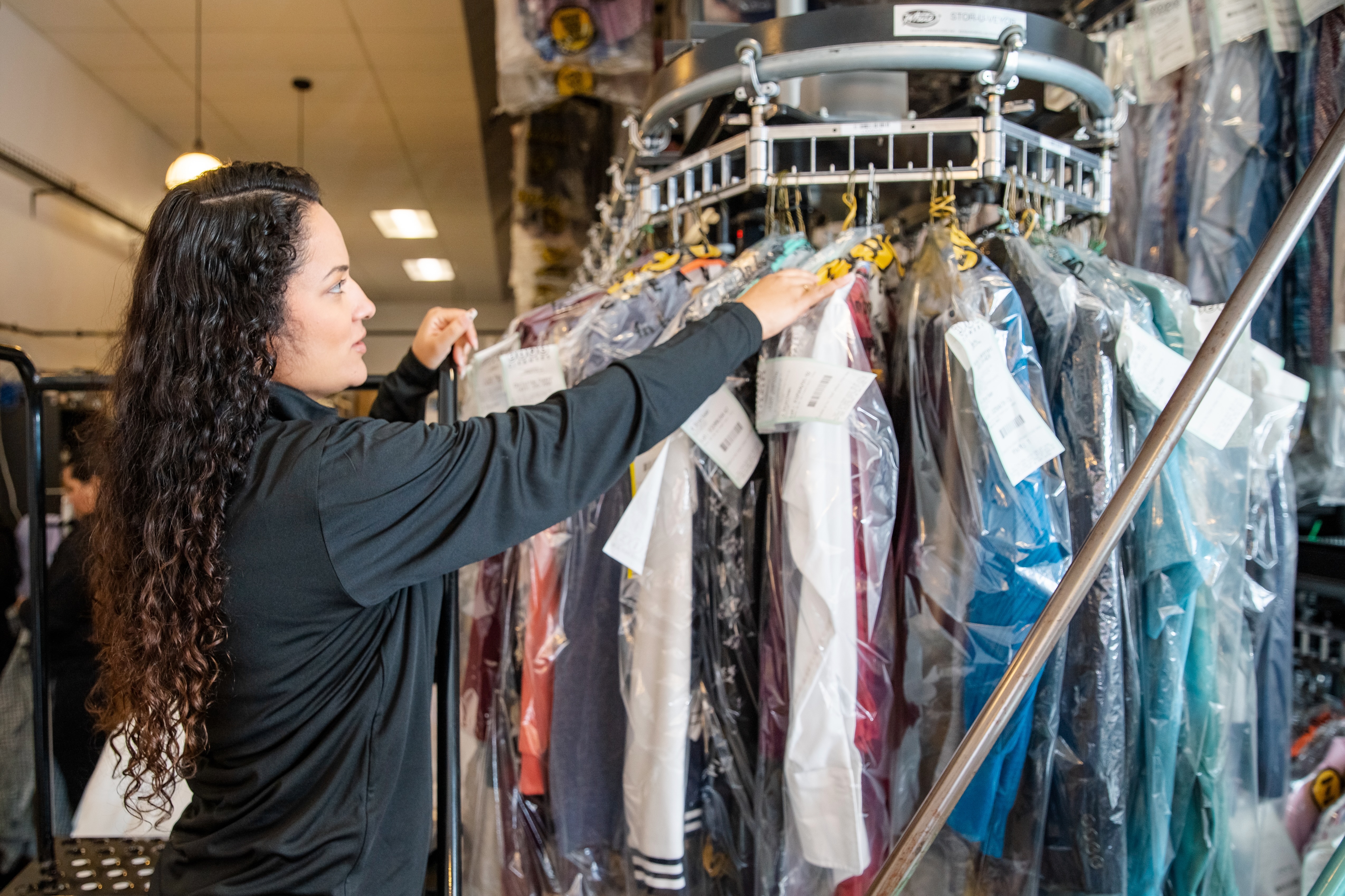 A friendly, professional ZIPS Cleaners Team Member quickly finds a customer order on our state-of-the-art conveyor. We've streamlined every part of the dry-cleaning process to provide the best possible service at the best possible price.