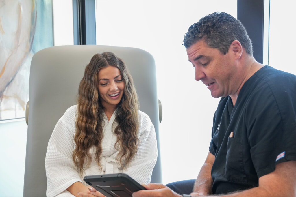 Plastic surgery consultation at Peak Plastic Surgery where a patient meets with a surgeon to discuss personalized treatment options.