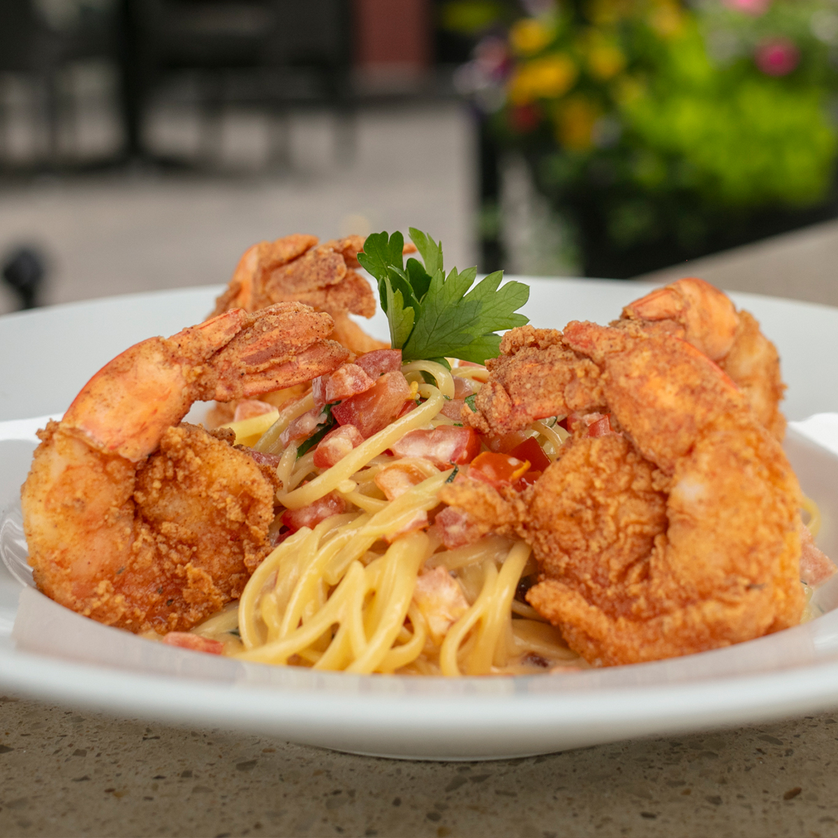 Shrimp Scampi | linguine, creamy garlic butter, tomato, chili flakes & parmesan