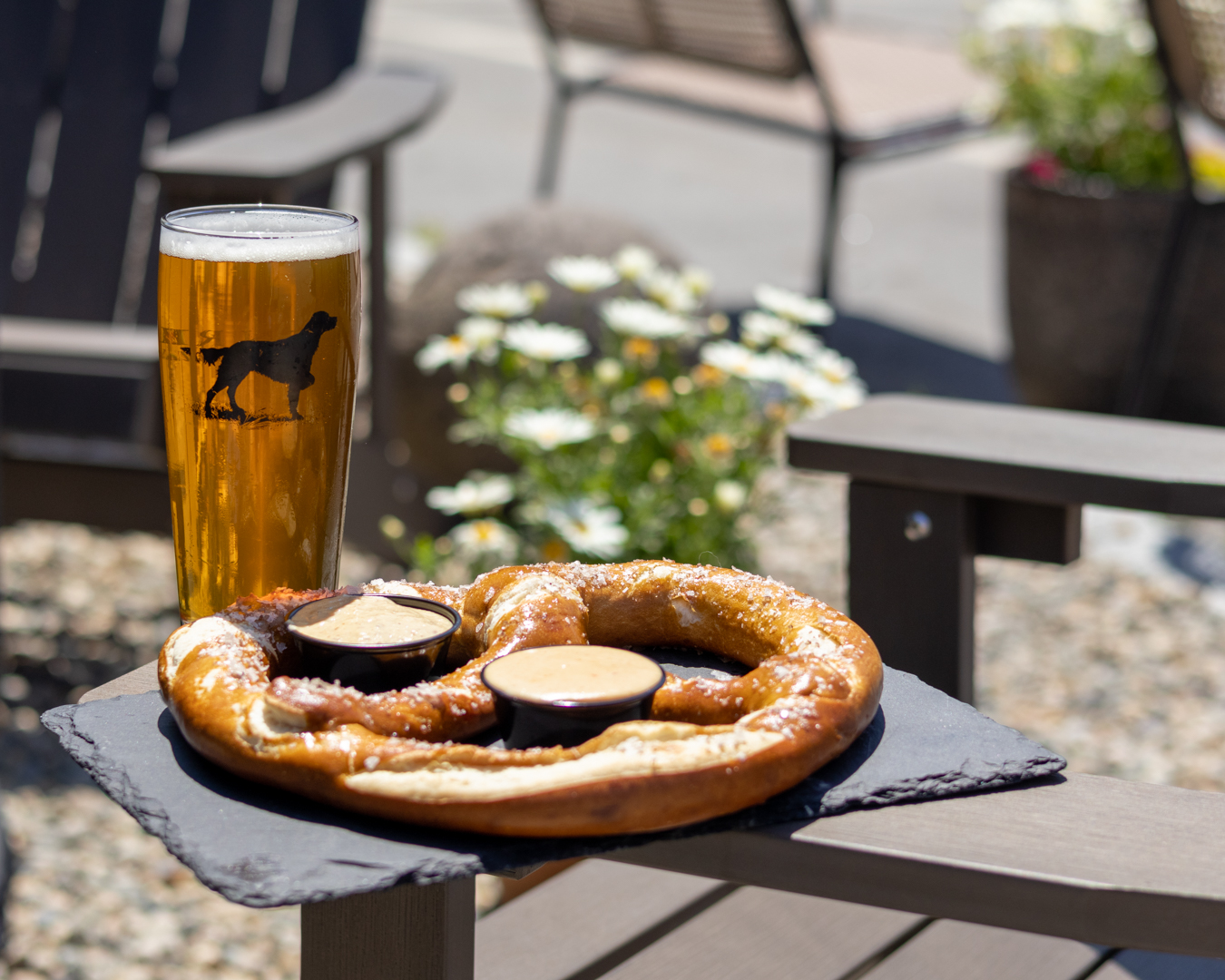 Sea Salted Pretzel served warm with Batson River beer cheese and stone-ground mustard, a savory shareable snack featuring house-made beer cheese sauce and stone ground mustard.