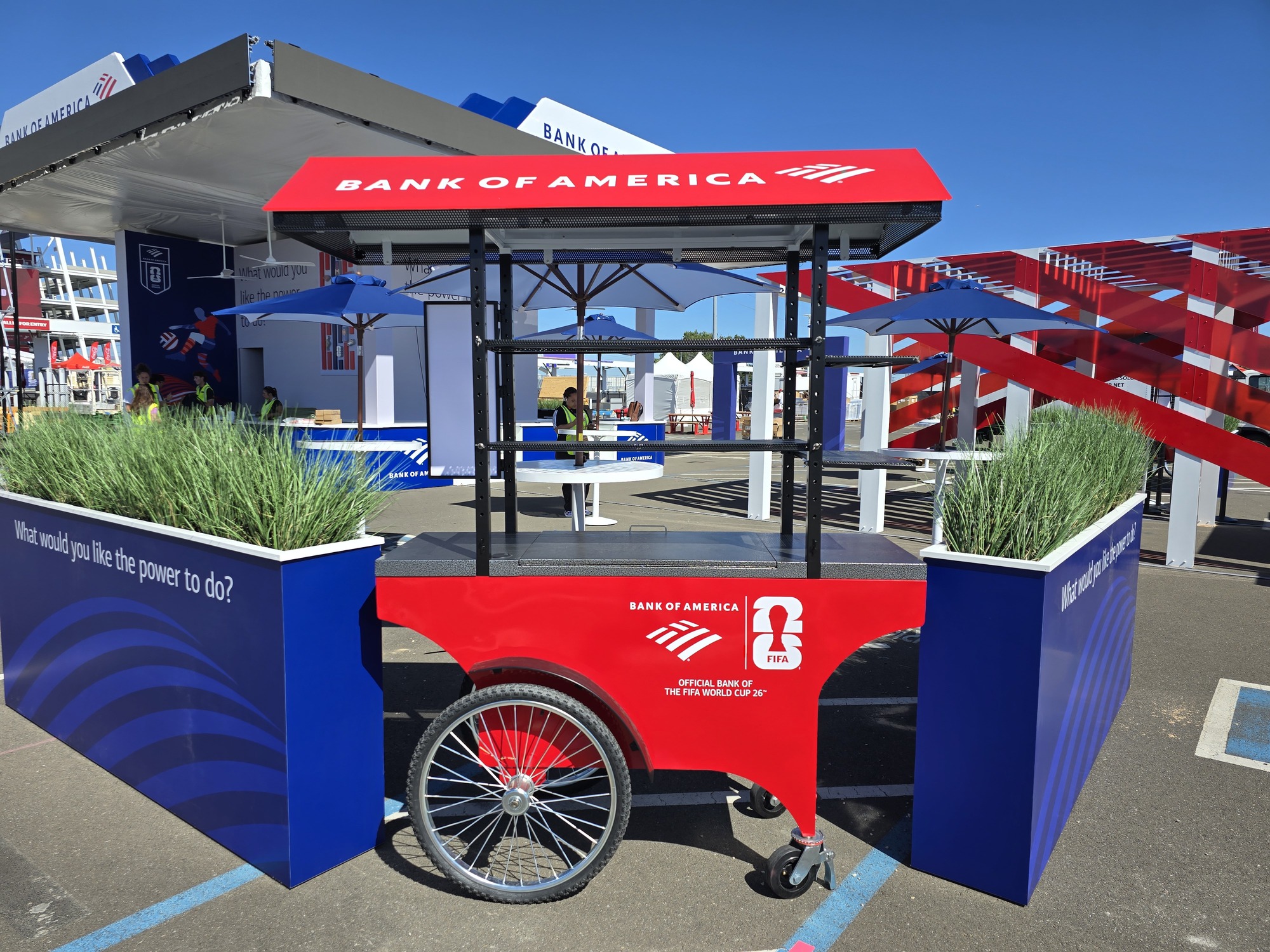 Branded Bank of America event cart positioned between custom planter walls as part of a FIFA World Cup experiential marketing display.