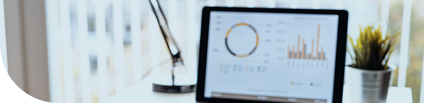 A laptop computer displaying financial charts.