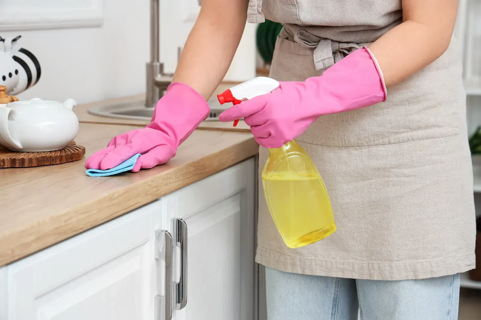 Routine countertop cleaning with disinfectant spray and microfiber cloth removes everyday dirt, bact 