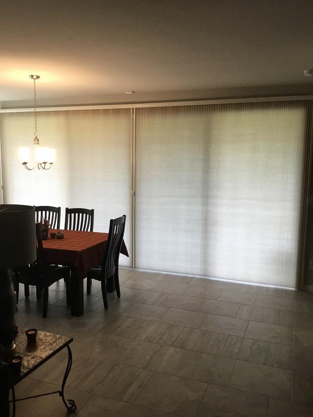 Signature Series Vertical Cellular Shades by Budget Blinds of Katy and Sugar Land provide the perfect amount of privacy at your Katy, TX sliding glass entryways!