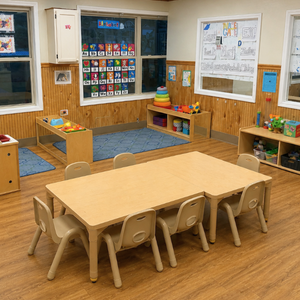 Bright and colorful preschool classroom at Childcare Network with age-appropriate learning materials 