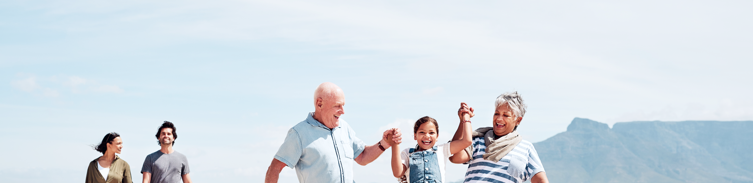 A multigenerational family on a walk together.