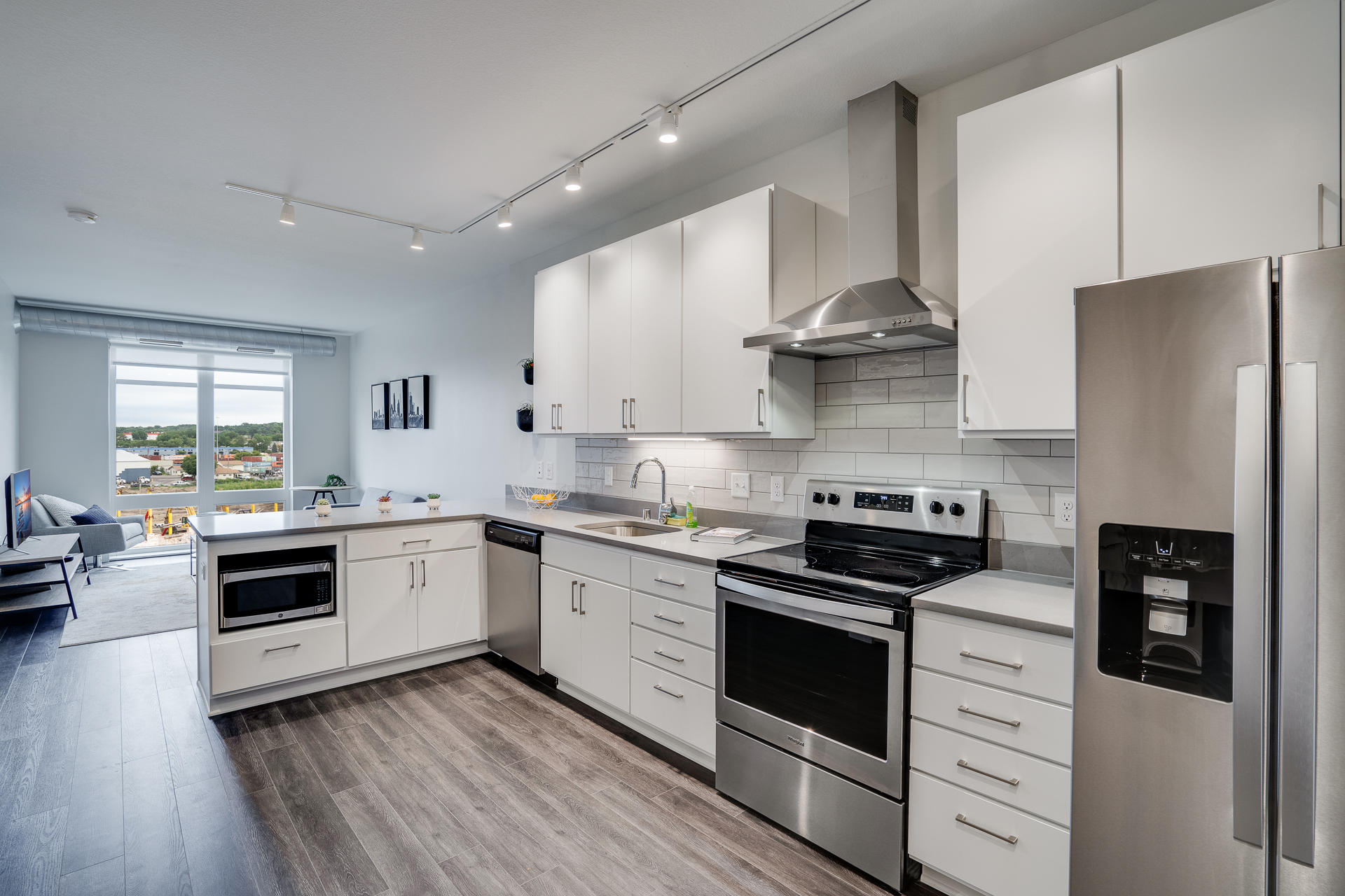 Spacious Kitchen With Stainless Steel Appliances & Quartz Countertops