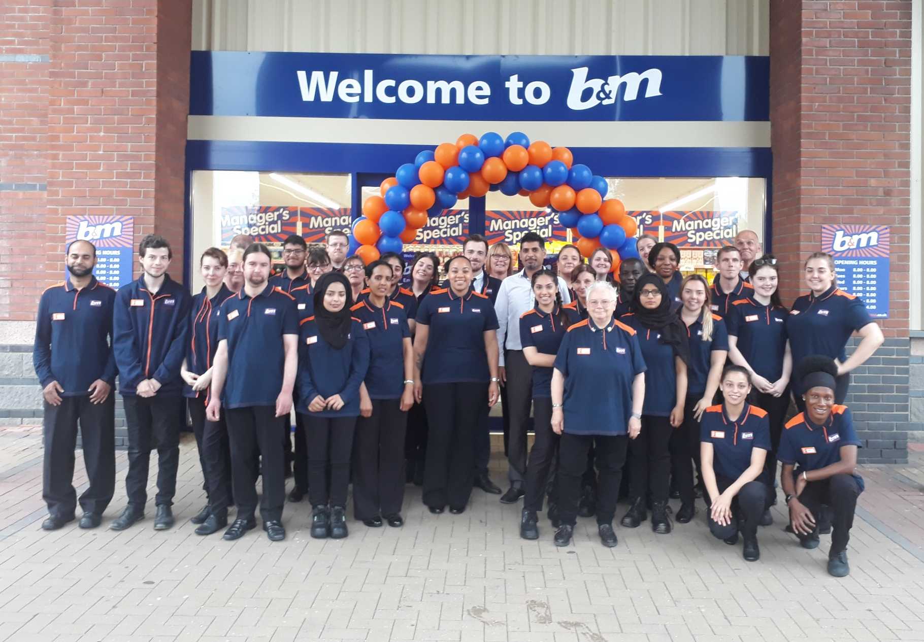 The store team at B&M's newest store in Cottingley, Leeds pose in front of their wonderful new B&M Store, located at Junction 1 Retail Park.
