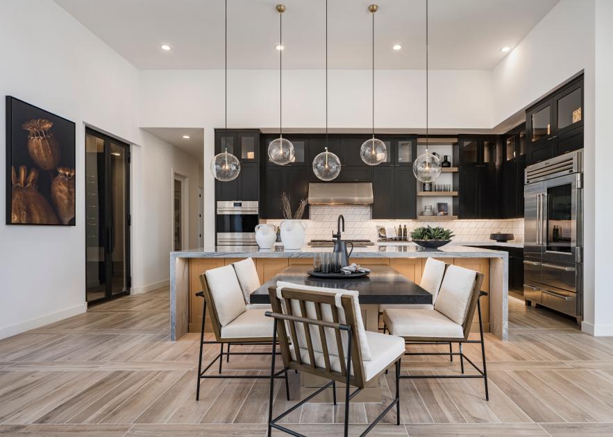 Stunning kitchens with ample cabinet space, large center islands, and high-end stainless steel appliances