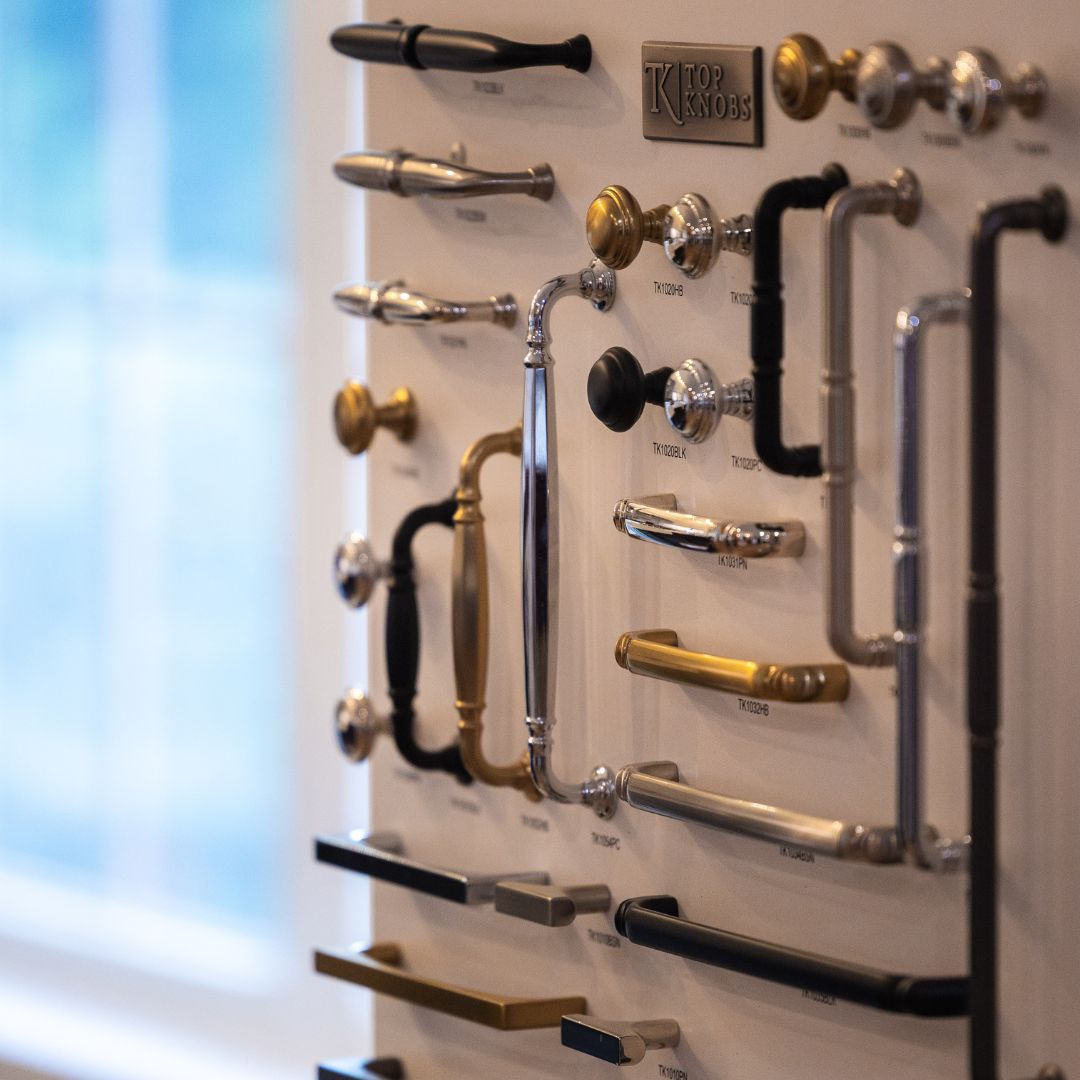 Display of decorative cabinet hardware featuring finishes from Top Knobs.