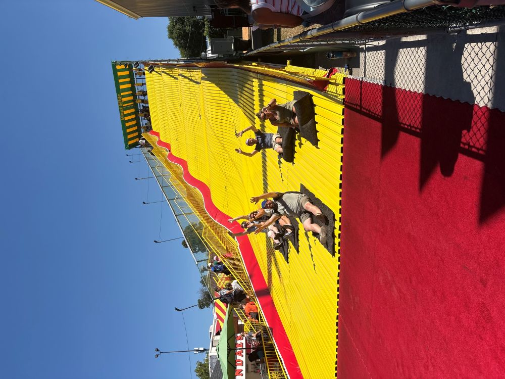 No trip to the Great Minnesota Get-Together is complete without a race down the iconic Giant Sing-Along / Giant Slide! The Clarity Financial team sliding down together on burlap sacks.