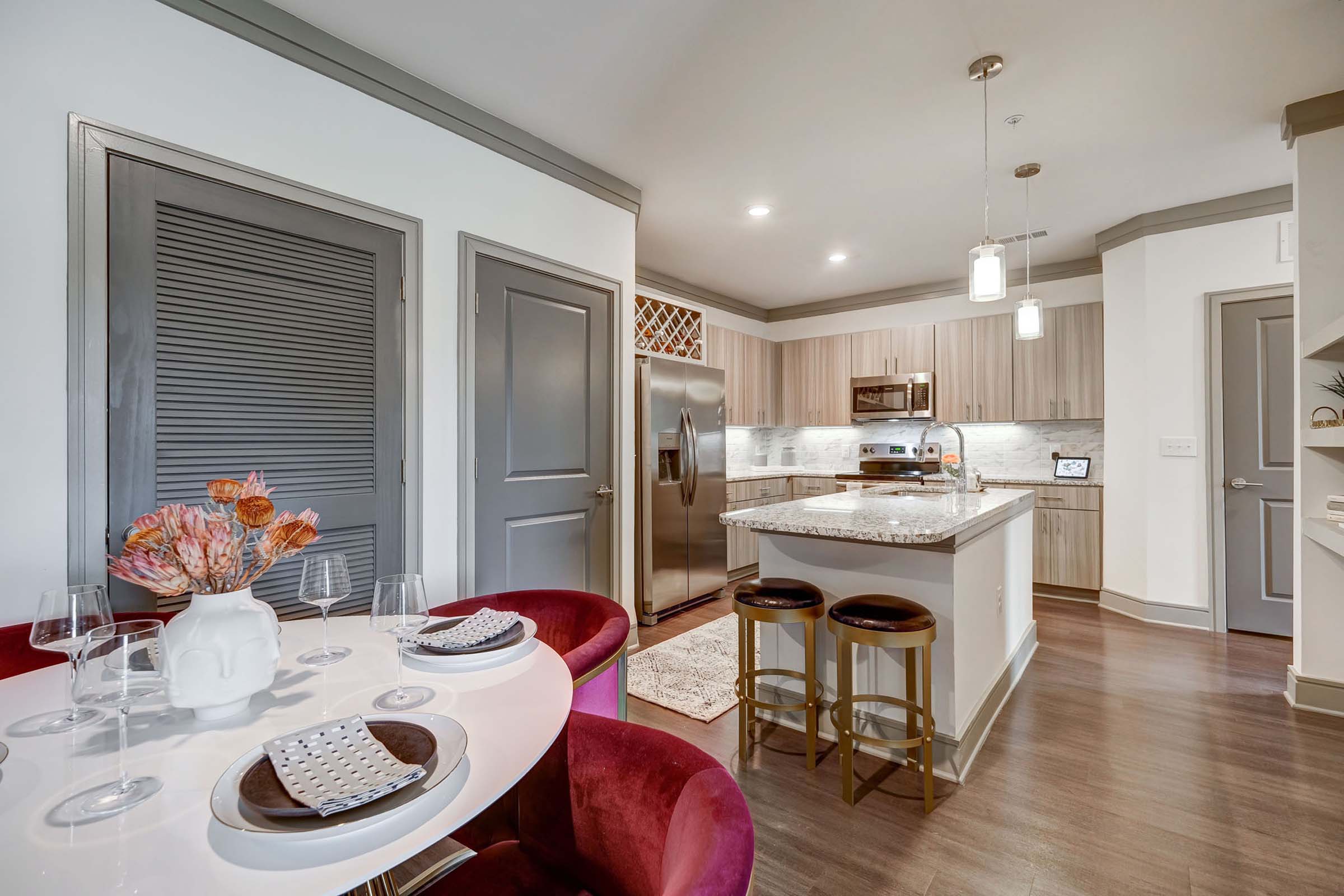 Dining and kitchen at Camden Alpharetta apartments in Alpharetta, GA.
