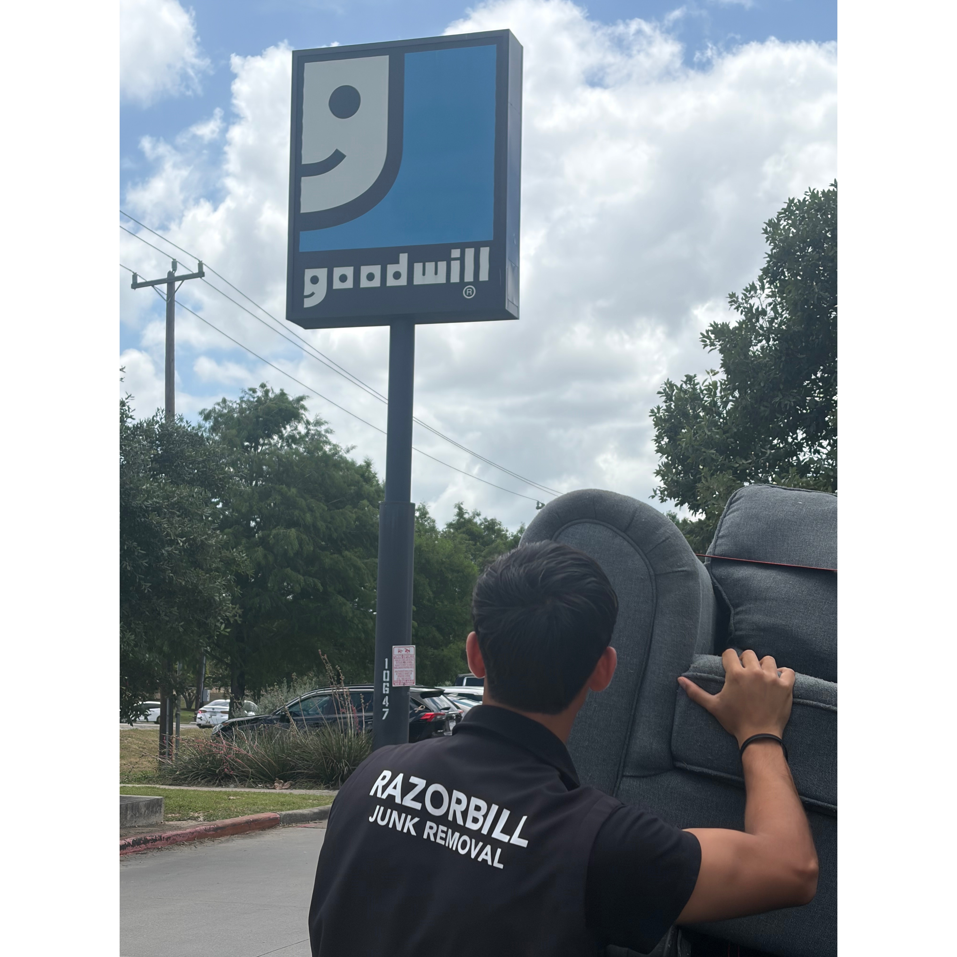 Razorbill junk removal worker donating couch to Goodwill 