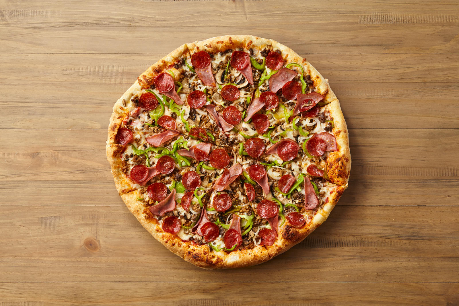 Johnny Brusco's New York Style Pizza - CLOSED - Loaded to the max! Sausage, onions, mushrooms, green peppers, beef, Canadian bacon & pepperoni.