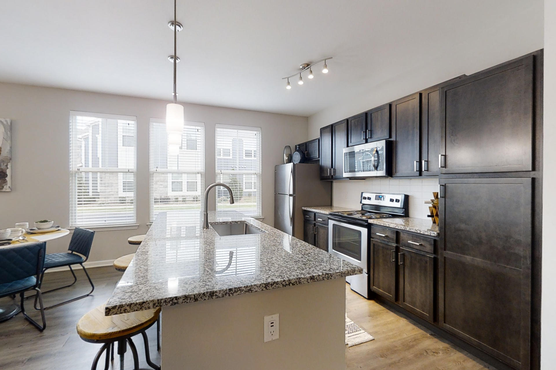 Fully-Equipped Kitchen With Stainless Steel Appliances & Granite Countertops