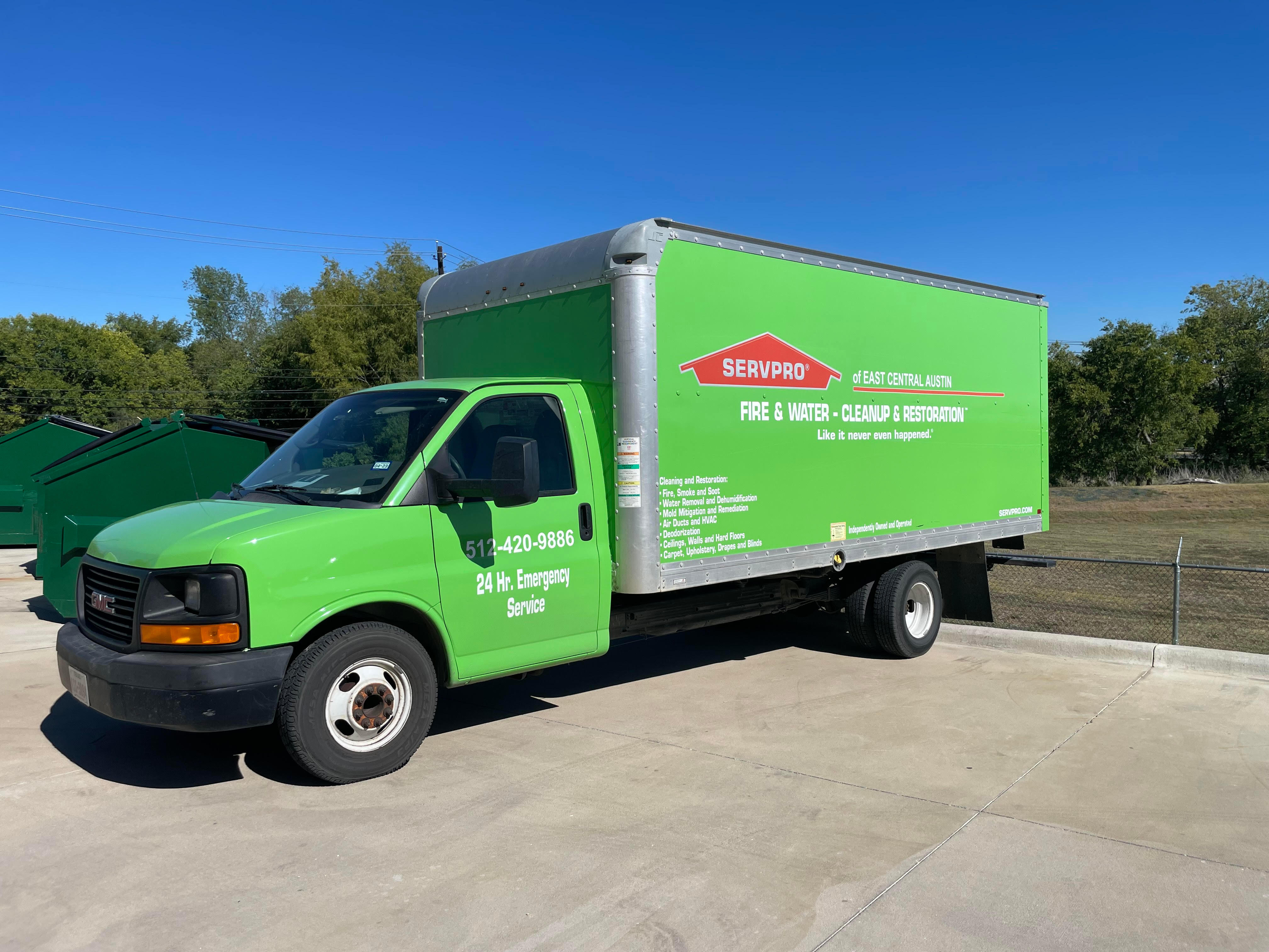 A SERVPRO® emergency response vehicle parked outside of the storefront.
