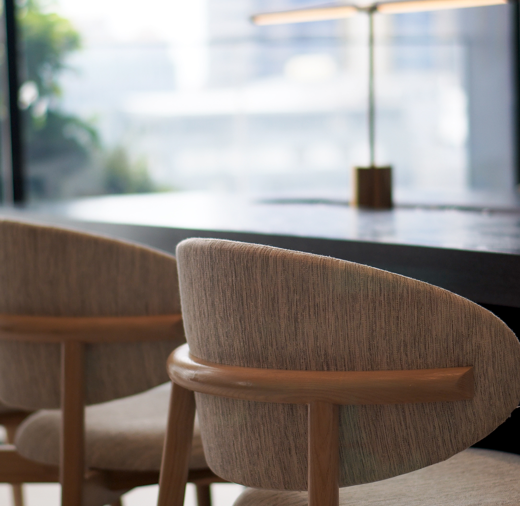 A close-up of two chairs in a meeting room.
