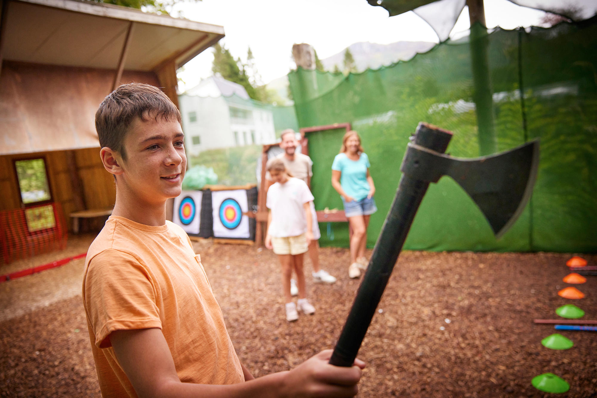 Family taking part in Axe Throwing with our Go Cove team