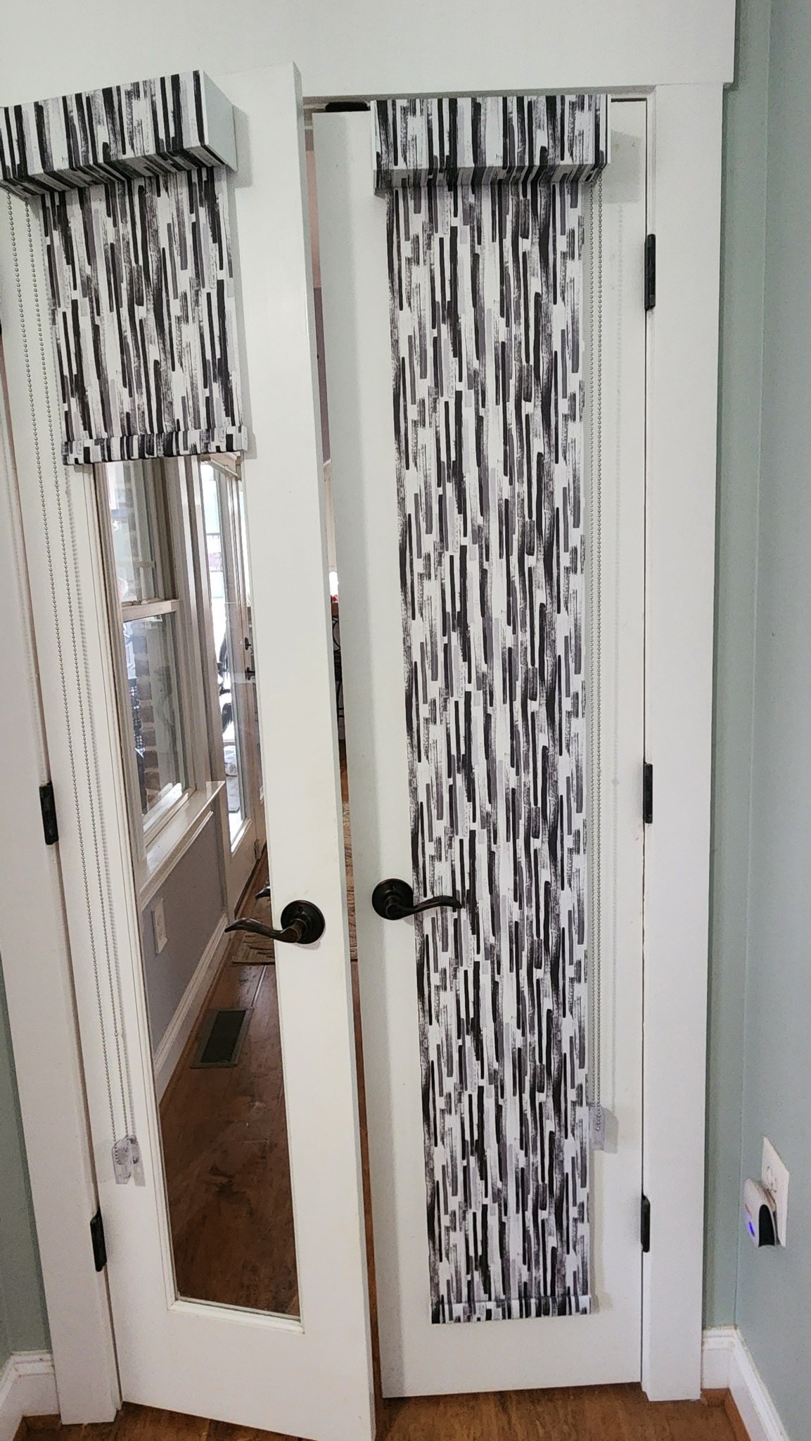 Custom Roller Shades with beautiful patterns in the Kitchen