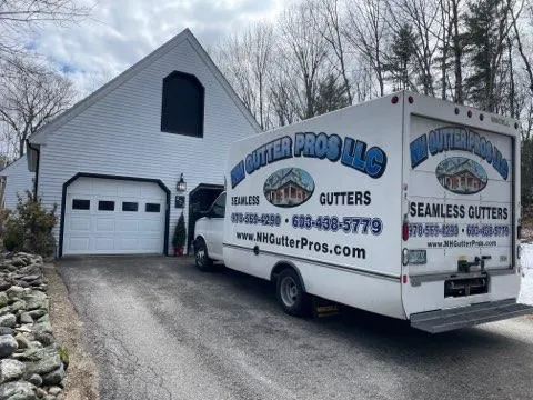 Company service truck parked outside a residential property. Vehicle branding promotes professional  