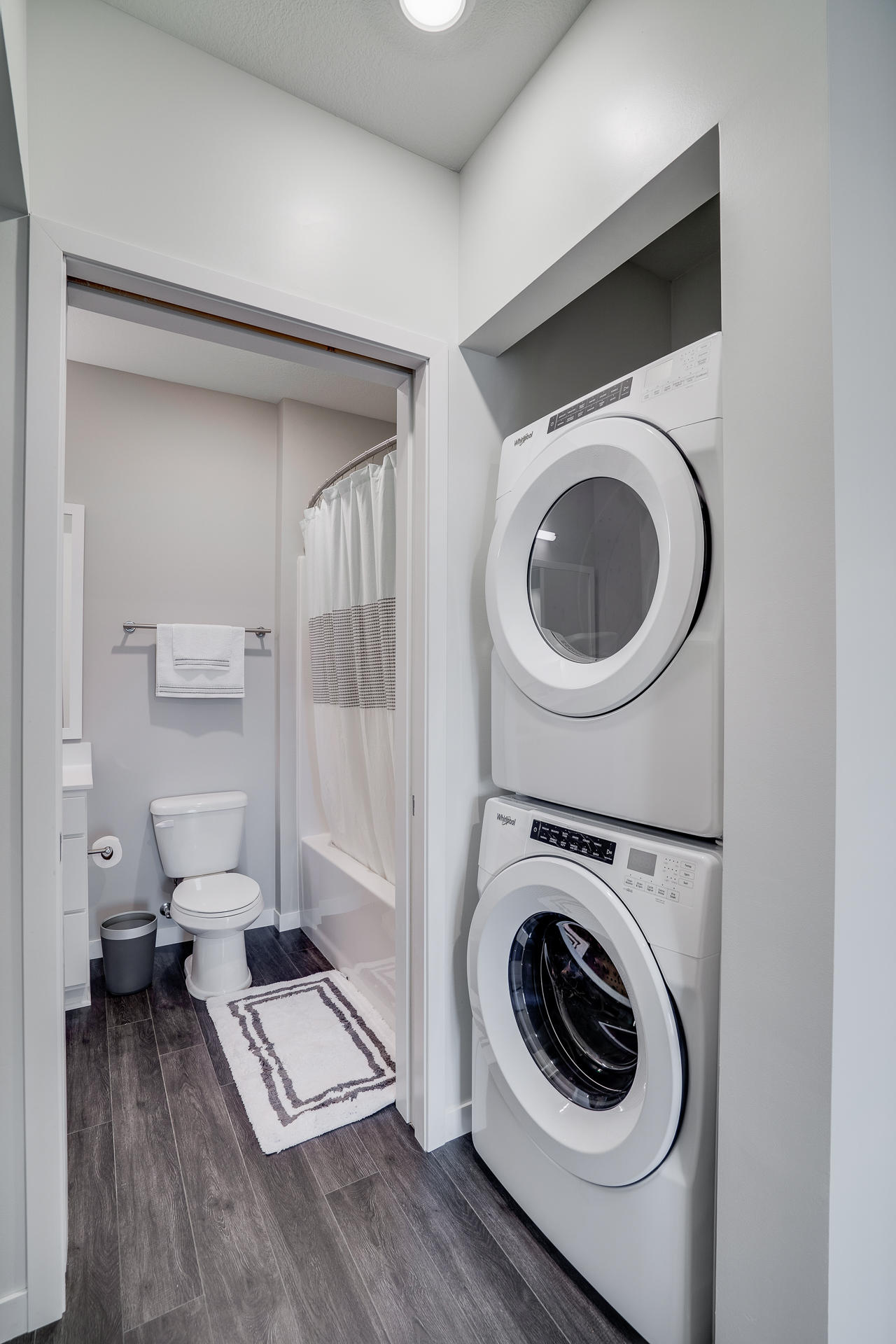 Walk-In Closet Featuring Full-Sized Washer & Dryer