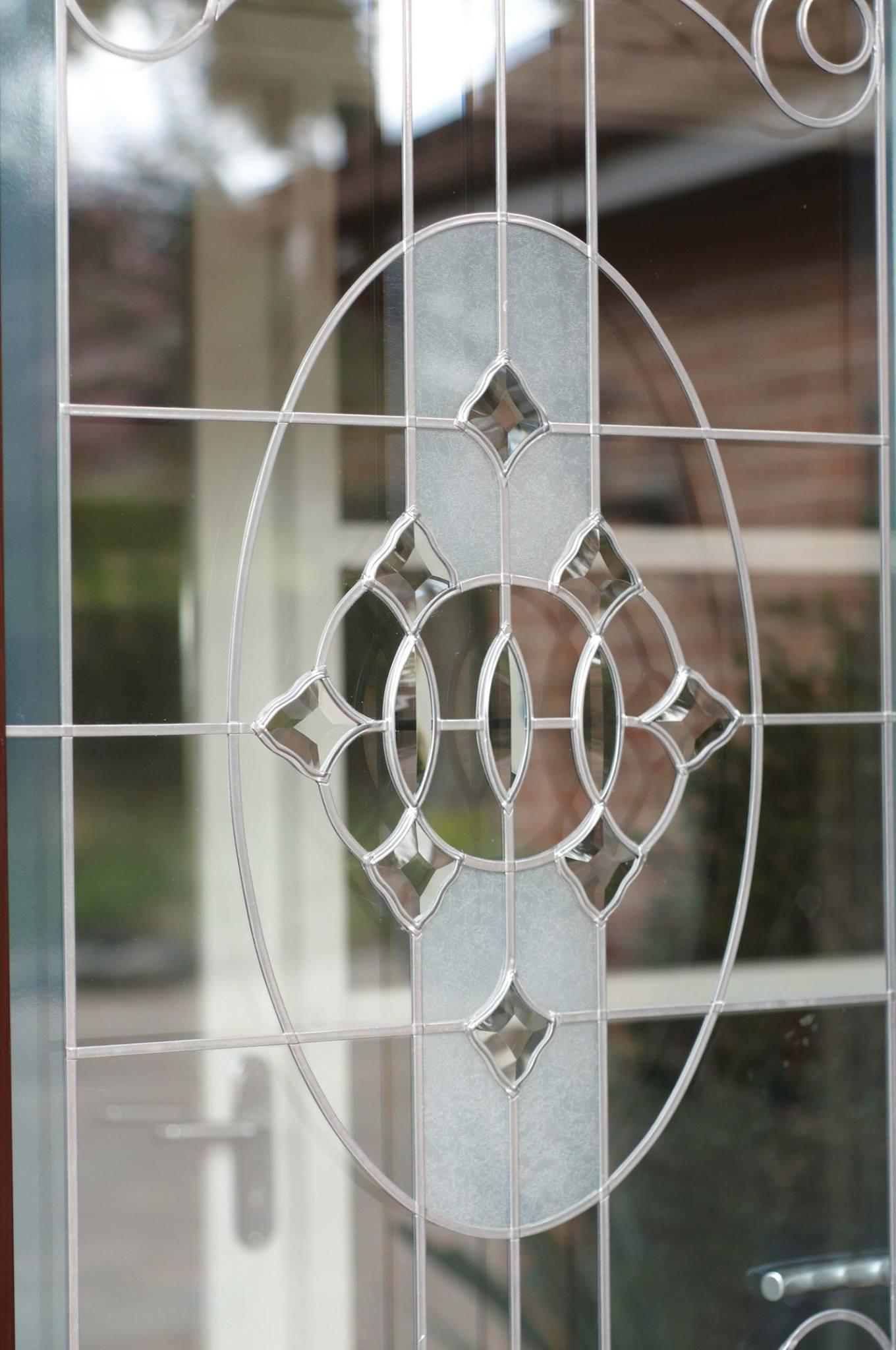 Add that personal touch to your windows, doors or conservatory with our wide range of decorative glass styles. Pictured: bevelled and etched front door design.