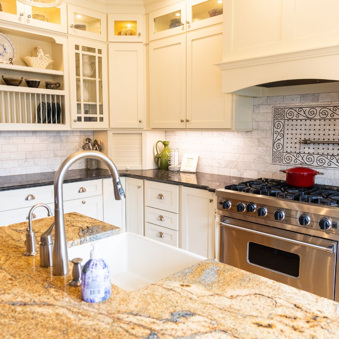 Stunning kitchen remodel with granite countertops, under-mount farm sink, and elegant cabinetry.