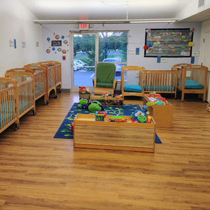 Bright and colorful preschool classroom at Childcare Network with age-appropriate learning materials