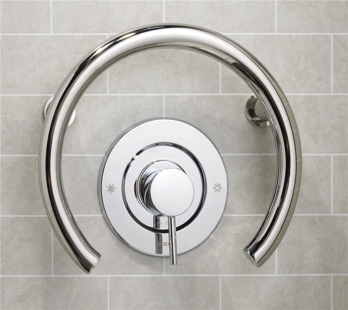 Polished chrome shower valve with grab bar detail in Portland, Maine bathroom remodel
