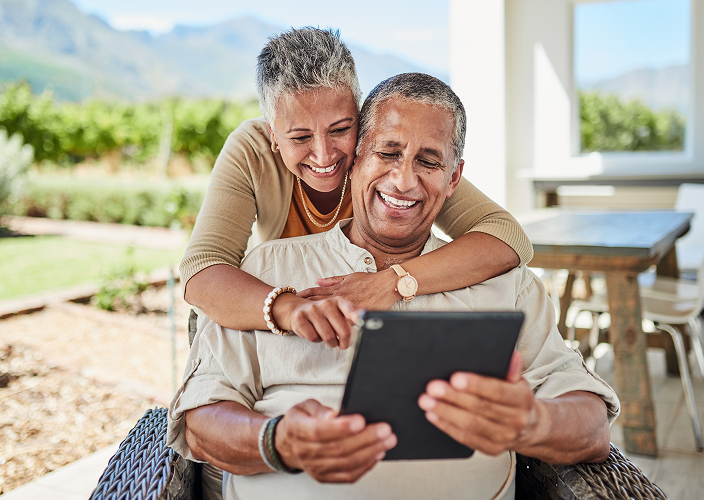 A couple reviewing an eDocument on their tablet.
