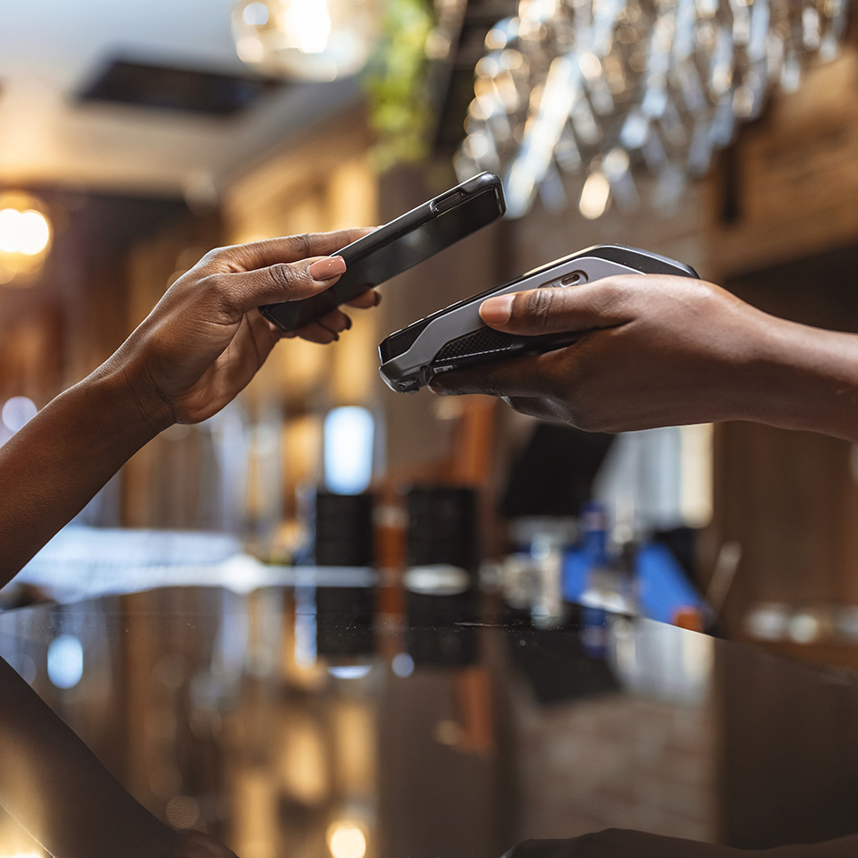 A person paying with a smartphone