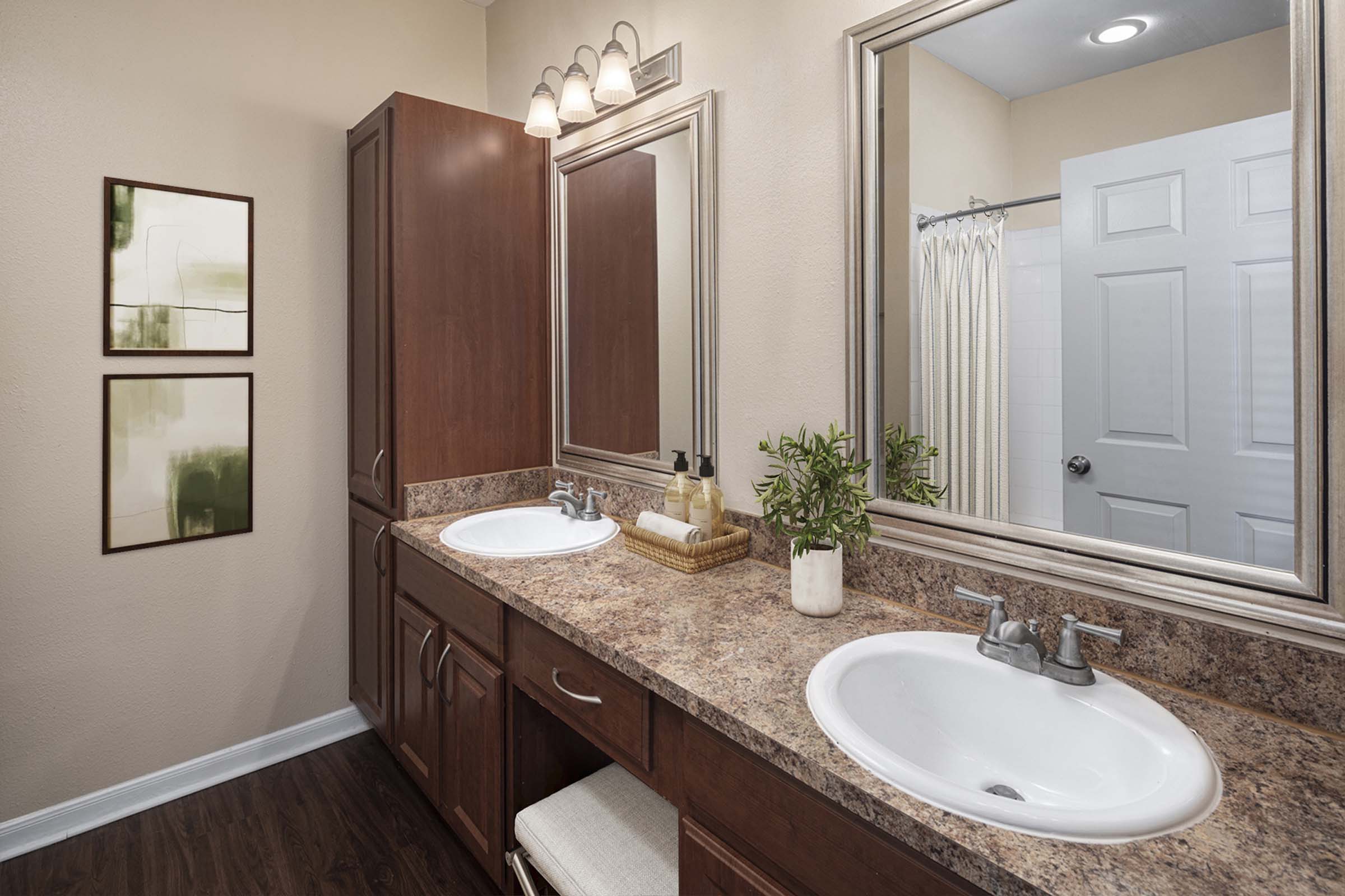 Bathroom with two sinks and vanity area at Camden Buckingham apartments in Richardson, Tx 